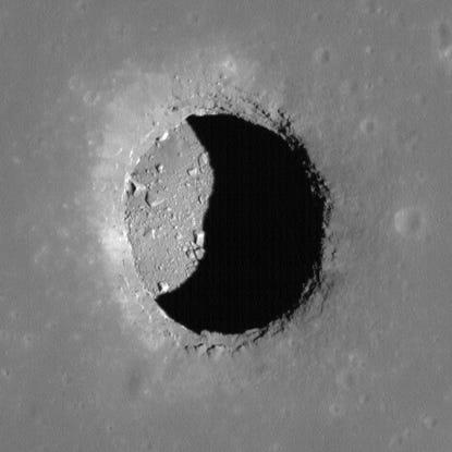 In a groundbreaking discovery, scientists have found compelling evidence of an underground cave on the moon, which could potentially serve as a safe and habitable environment for astronauts. This finding marks a significant milestone in the ongoing quest to establish a permanent human presence on the lunar surface. The discovery, detailed in a recent paper by a team of Italian researchers, suggests that there may be hundreds of such caves hidden beneath the moon's surface.

The Discovery and Its Implications

For years, scientists have speculated about the existence of underground caves on the moon. Now, thanks to radar technology and data from NASA's Lunar Reconnaissance Orbiter, researchers have identified a large cave situated within the Mare Tranquillitatis pit. This pit likely formed when a lava tube collapsed, creating a vast underground cavity. The cave is estimated to be about 150 feet wide and up to 260 feet long, slightly smaller than an American football field.

The discovery is particularly exciting because these caves could provide a stable and protective environment for astronauts. Unlike the moon's surface, which experiences extreme temperature fluctuations and high radiation levels, the interior of these caves would offer consistent temperatures and natural shielding from radiation. According to Katherine Joy, a professor of earth sciences at the University of Manchester, "The thick cave ceiling of rock is ideal to protect people and infrastructure from the wildly varying day-night lunar surface temperature variations and to block high-energy radiation."

The Formation and Exploration of Lunar Caves

The moon's surface is dotted with lava tubes, remnants of volcanic activity from billions of years ago. Over time, some of these tubes have collapsed, creating pits and potential cave entrances. Radar images have identified over 200 of these pits, suggesting that many more caves could exist beneath the lunar surface. These caves could revolutionize moon missions by providing natural shelters for astronauts, making the construction of surface habitats unnecessary.

However, accessing these caves presents its own set of challenges. The Mare Tranquillitatis cave, for example, is located over 400 feet from the surface, at the bottom of a steep slope filled with loose debris. Innovative technologies, such as jet packs or lunar elevators, would be required to transport astronauts in and out of these pits safely.

Exploring these caves could yield valuable scientific data and resources for future space missions. Radar technology could help map the interior of these caves, identifying the best locations for future lunar bases. Additionally, these caves might harbor water ice, a crucial resource for any sustained lunar presence. Water could be used for drinking, as well as broken down into hydrogen for rocket fuel and oxygen for breathing.

The Future of Lunar Exploration

The discovery of this moon cave opens up exciting possibilities for future lunar exploration. Scientists believe that these caves could serve as fossilized records of the moon's volcanic history, providing insights into its geological past. Moreover, the presence of water ice in these caves could support not only lunar bases but also missions to Mars and beyond.

As researchers continue to explore and map the lunar surface, the identification of more caves could significantly impact NASA's plans for a permanent human presence on the moon. By utilizing these natural shelters, astronauts could be protected from the harsh lunar environment, making long-term habitation more feasible.

The discovery of an underground cave on the moon represents a significant step forward in our understanding of the lunar surface and its potential for human habitation. With further exploration and technological advancements, these caves could become key components of future lunar missions, providing safe havens for astronauts and valuable resources for sustaining human life beyond Earth.